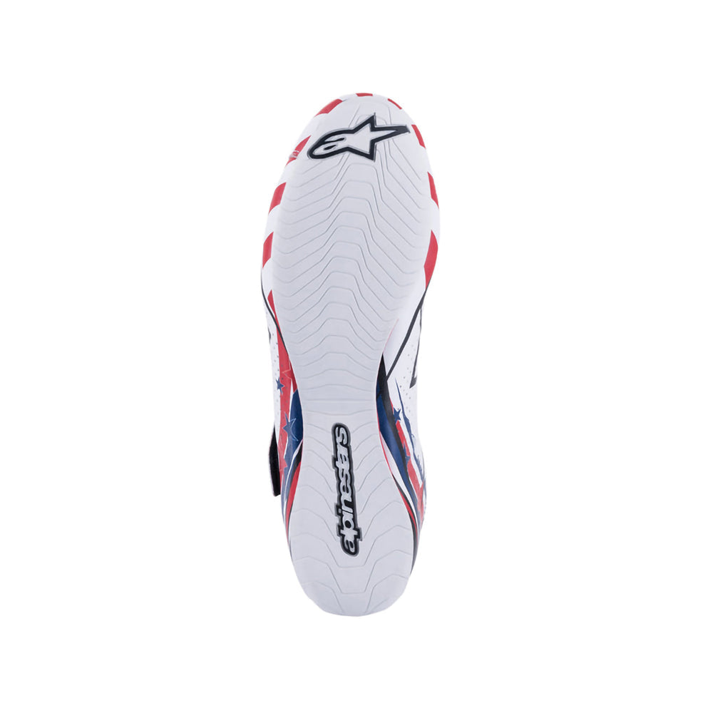 White Alpinestars Supermono v2 Grand Prix Racing sports shoe with red and blue accents on a white background