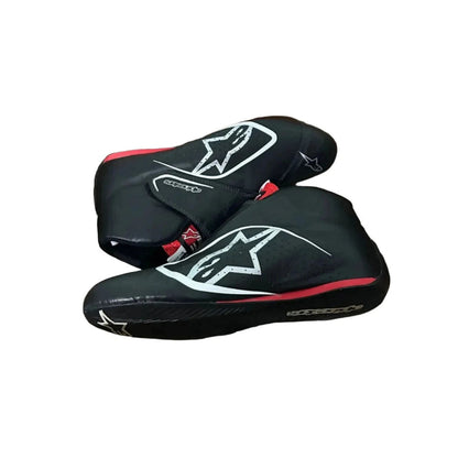 Black Carlos Sainz 2017 F1 racing shoes with a logo on a white background