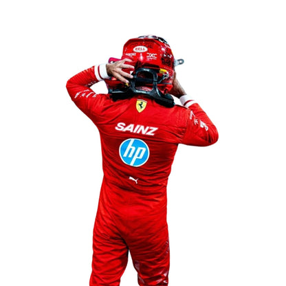Back view in Ferrari red, showing elasticated cuffs at wrists and ankles, reinforced seams, and a full-length zip extending from neck to waist for quick changes.