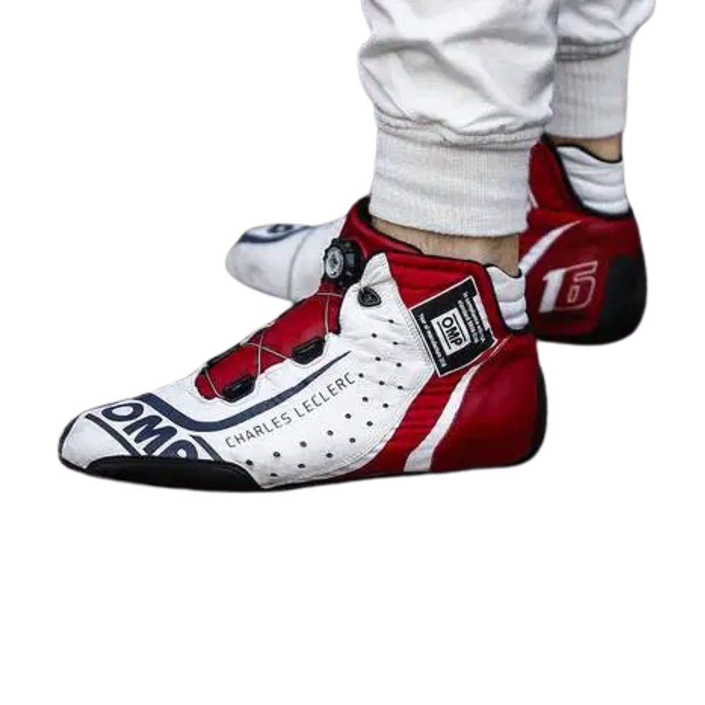 Red and white Charles Leclerc 2018 F1 racing shoes with visible branding on a white background