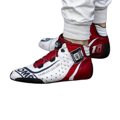 Red and white Charles Leclerc 2018 F1 racing shoes with visible branding on a white background