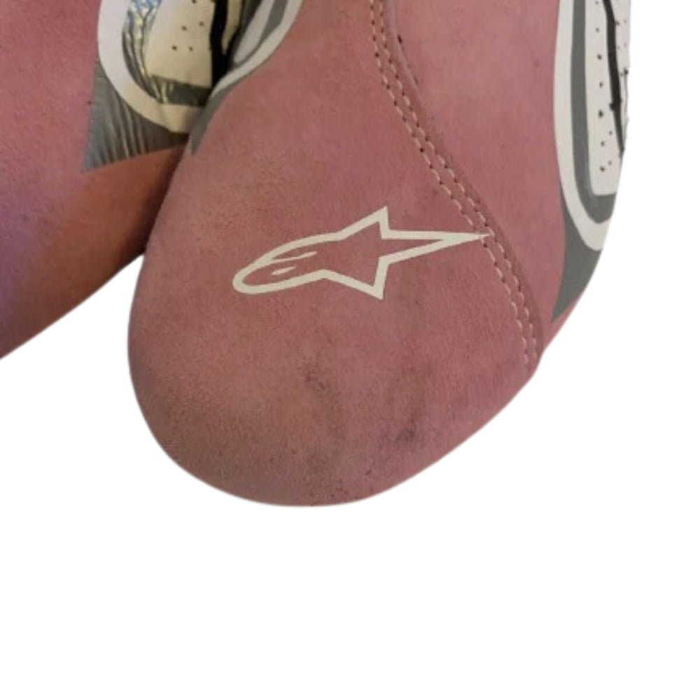 Close-up of a red Esteban Ocon 2018 F1 Racing shoes with a star logo on a white background