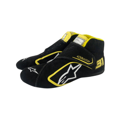 Black and yellow Esteban Ocon 2020 Tuscan GP F1 Racing shoes with a prominent logo on a white background