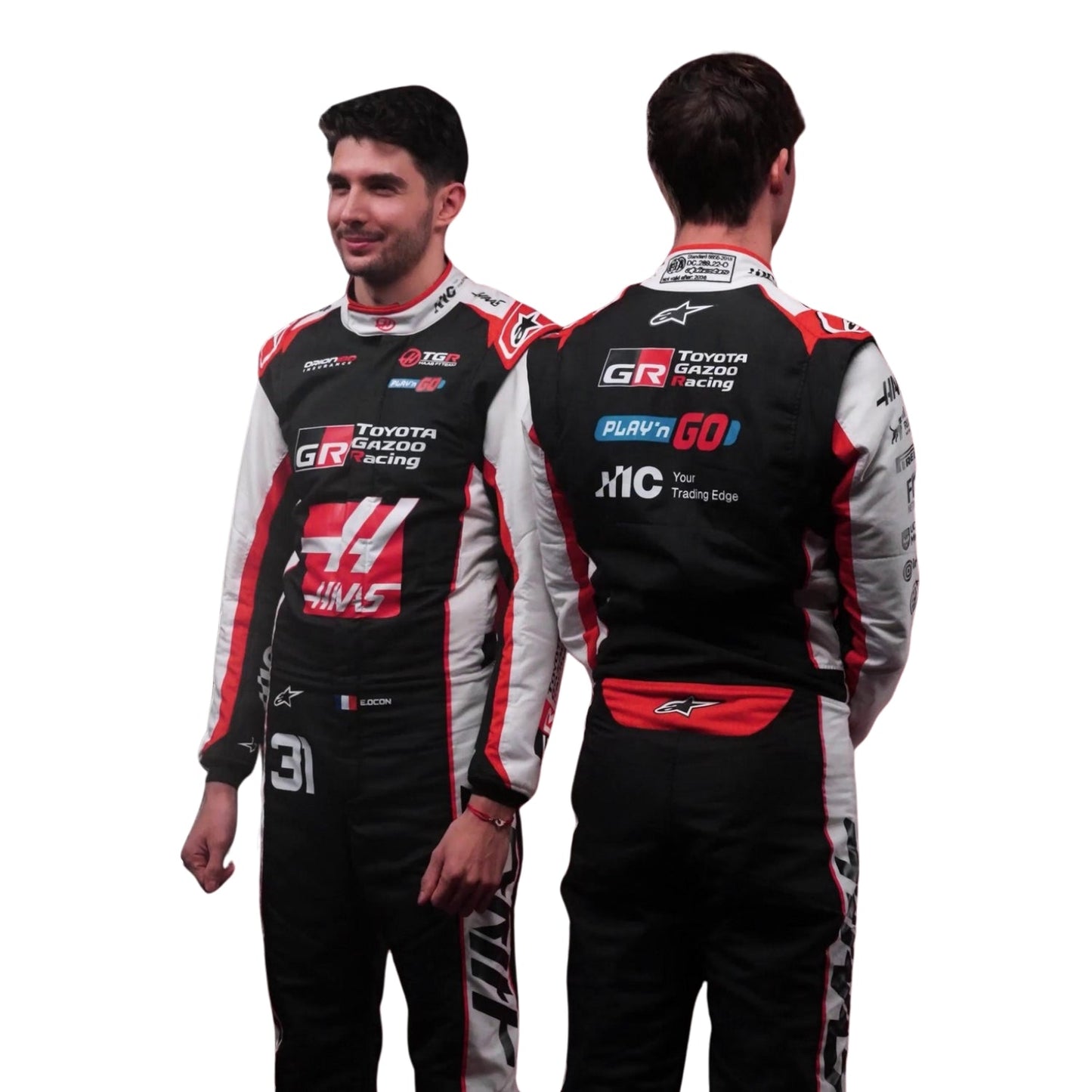 Esteban Ocon and Oliver Standing in a same picture Wearing 2026 Haas F1 Racing Suit