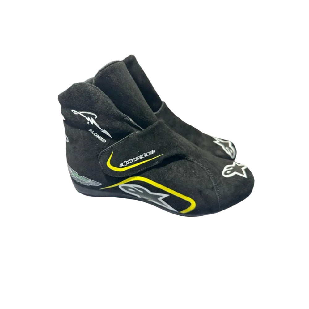 Black Fernando Alonso Aston Martin 2023 F1 racing shoes with visible branding on a white background