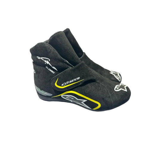 Black Fernando Alonso Aston Martin 2023 F1 racing shoes with visible branding on a white background