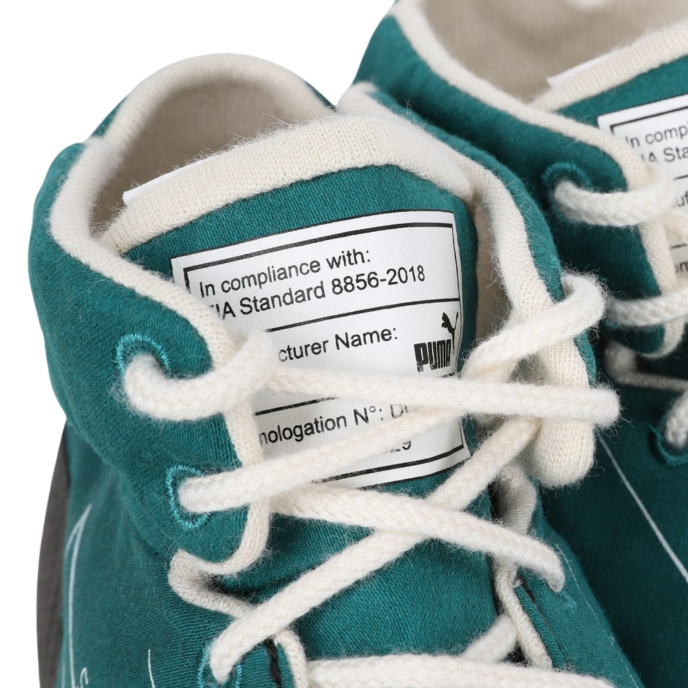 Teal Lance Stroll Dutch GP 2022 F1 racing sneakers with white laces and a visible label on a white background