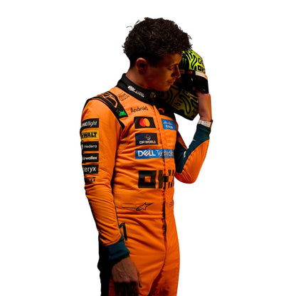 Lando Norris Wearing 2026 McLaren F1 Racing Suit Holding Helmet