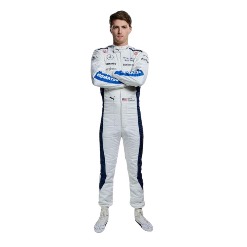 Logan Sargeant wearing a white Williams 2024 F1 racing suit with blue accents on a white background