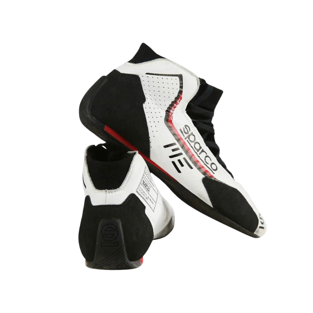 Black and white Marcus Ericsson 2021 Indy 500 Racing shoes with 'Spektrum' branding on a white background