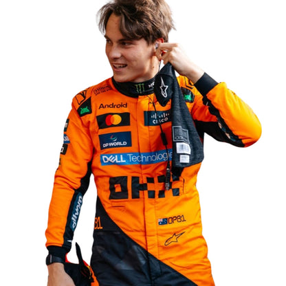 Close-up of fabric texture and detailed stitching on Oscar Piastri’s 2025 F1 racing costume showcasing premium finishes and logo embroidery.