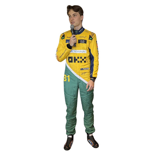 Oscar Piastri wearing a yellow and green McLaren F1 racing suit in Monaco GP with a microphone, on a white background