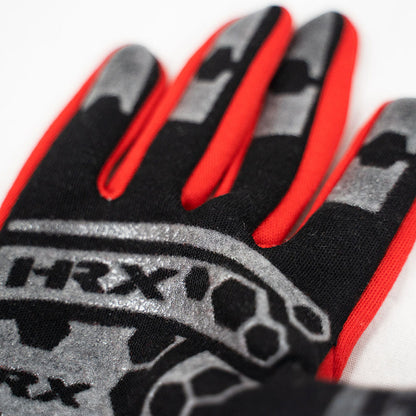 Close-up of a glove with red, black, and gray design on a white background