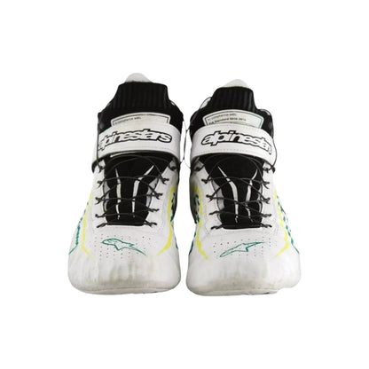 Pair of white Tony Kanaan Indy 500 2022 Chip Ganassi Racing shoes with black and green accents on a white background